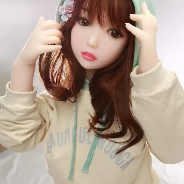 TPE petite sex doll shown in unboxed standing pose, full-body display
